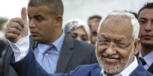 Rachid Ghannouchi, leader of the Tunisian moderate Islamist Ennahda Party, gestures before casting his vote at a polling station in Ben Arous, Tunisia, Sunday Oct. 26, 2014. Tunisians lined up Sunday to choose their first five-year parliament since they overthrew their dictator in the 2011 revolution that kicked off the Arab Spring. (AP Photo/Aimen Zine)