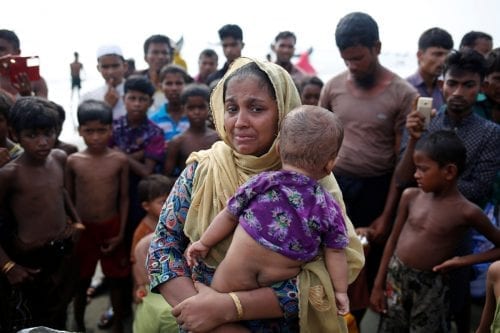 A Rohinkgya refugee woman cries after crossing the Bangladesh-Myanmar border by boat through the Bay of Bengal in Teknaf, Bangladesh, September 5, 2017. REUTERS/Mohammad Ponir Hossain - RC1EB76A7540